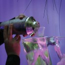 Pouring a martini through an ice sculputure